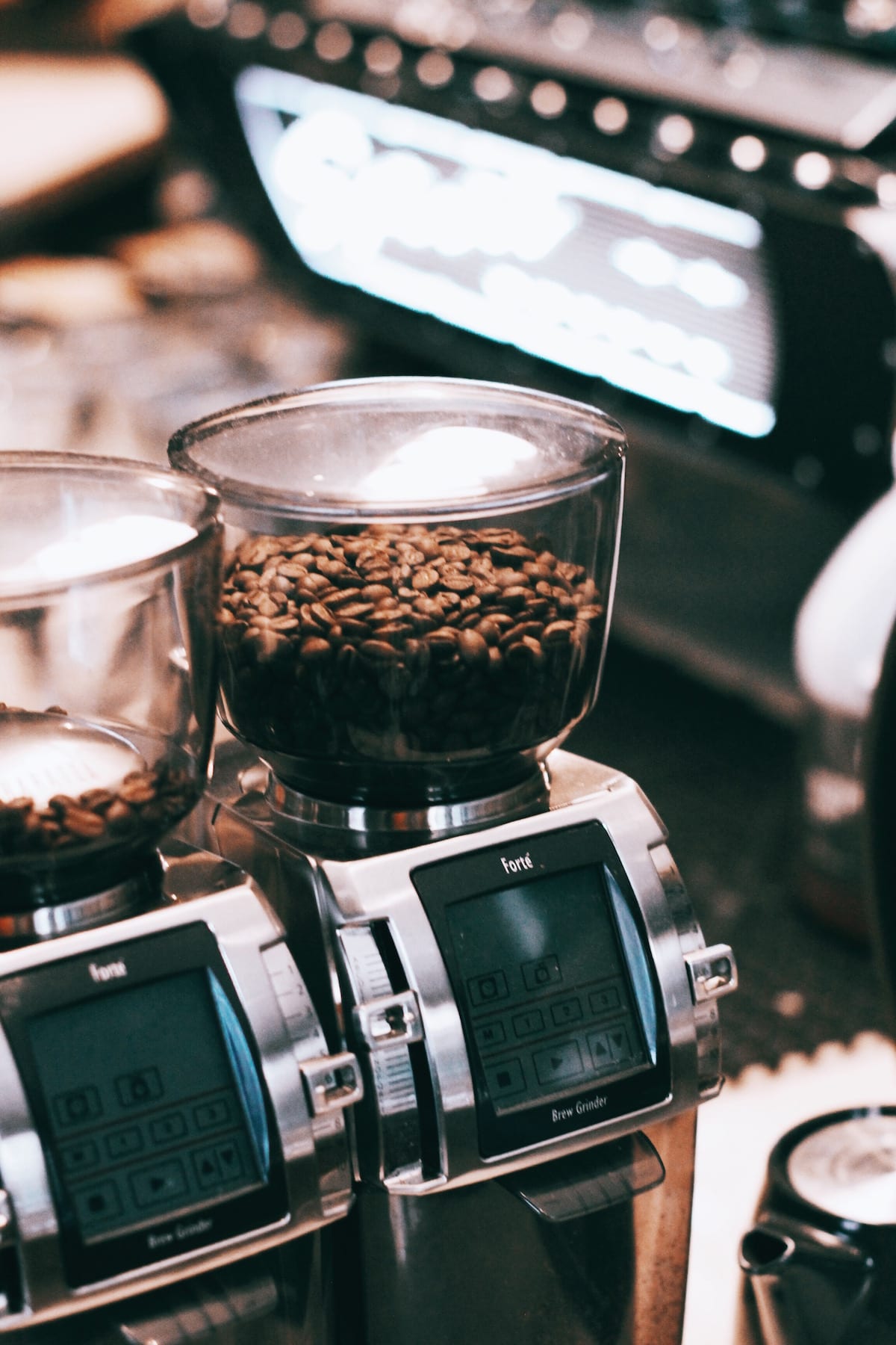 Whole coffee beans on coffee grinder machine